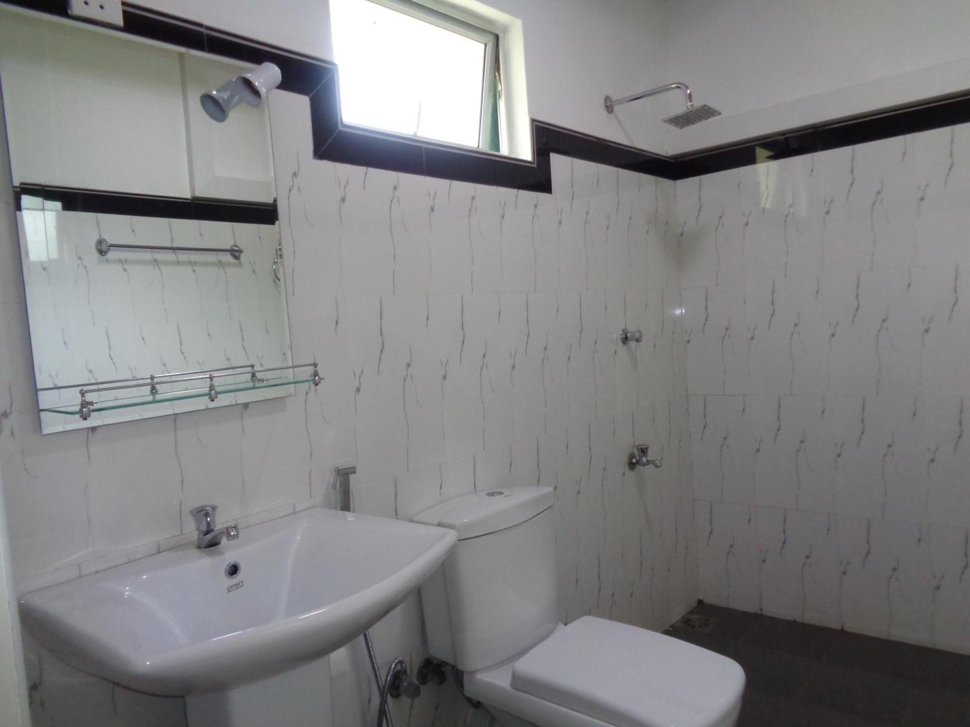 Man Guest Polonnaruwa Hotell Rom bilde